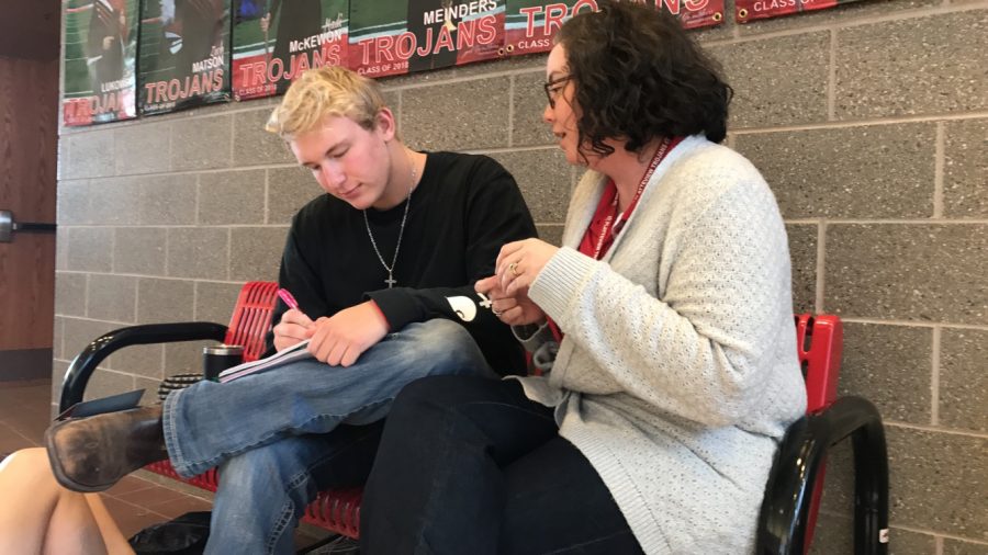 Mrs. Jennings and Jake Nelson talk about an assignment during Study Hall.