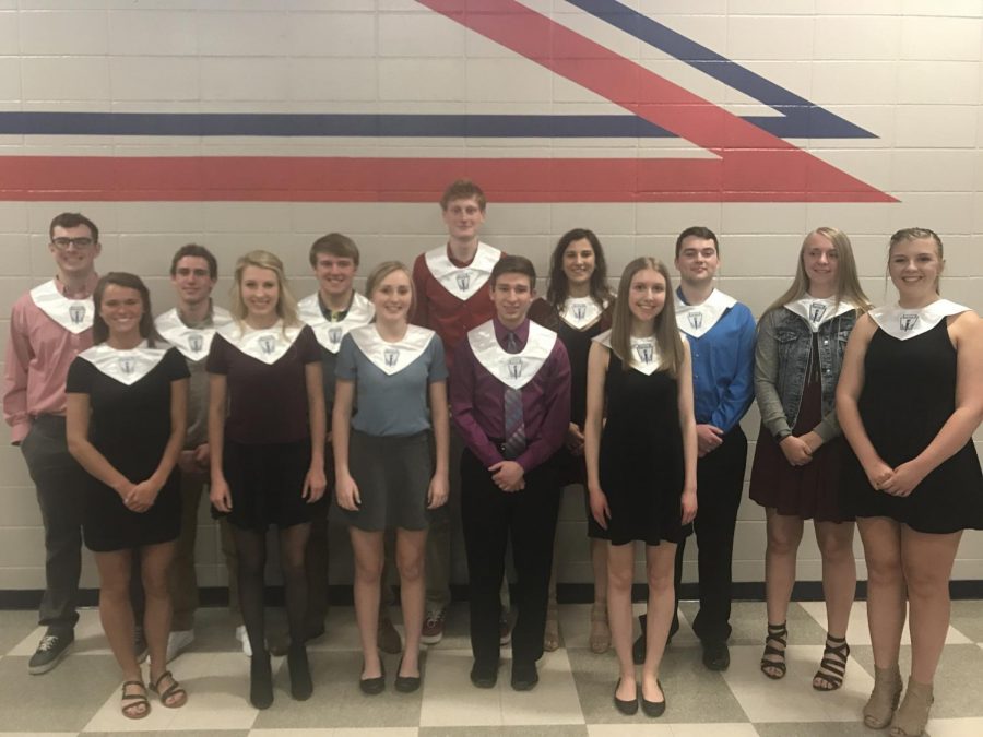 The 2018 National Honor Society graduates watch the induction for the following year of NHS.