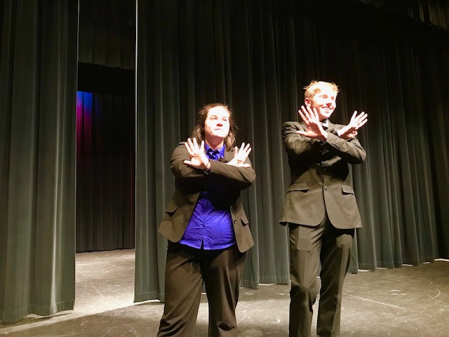 Rachel Rockwell and Reed Lenker sell the crowd their amazing invention in their speech “The Least Offensive Play in the Whole Darn World.”