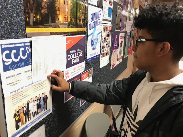 Diery Perez checks out the board by the front office for college materials.
