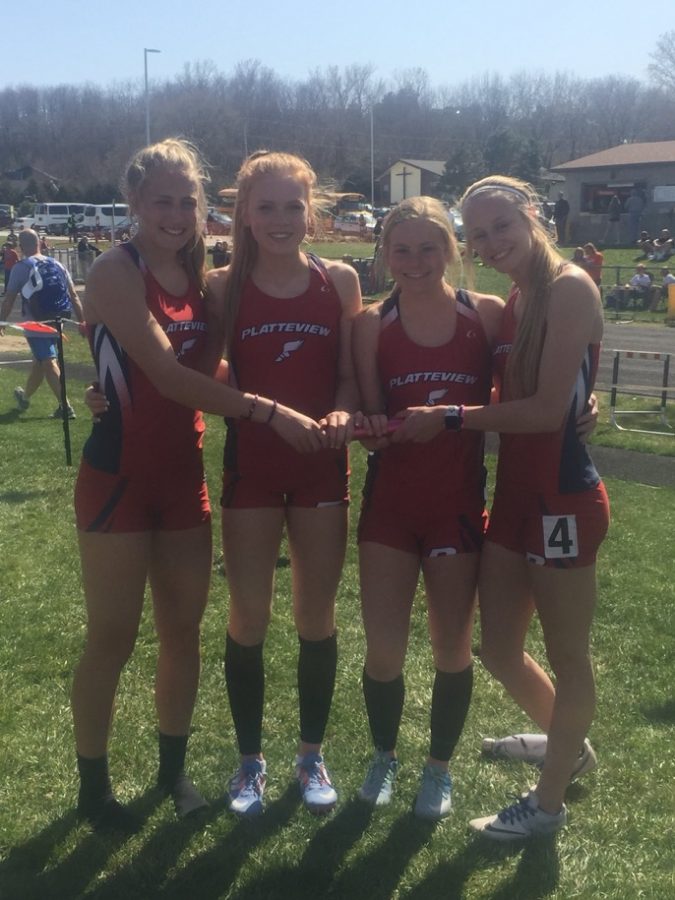 Jacque McCullough, Anna Koehler, Abby Husing, and Carrie Simmonson celebrate finishing the 4x100 meter relay.