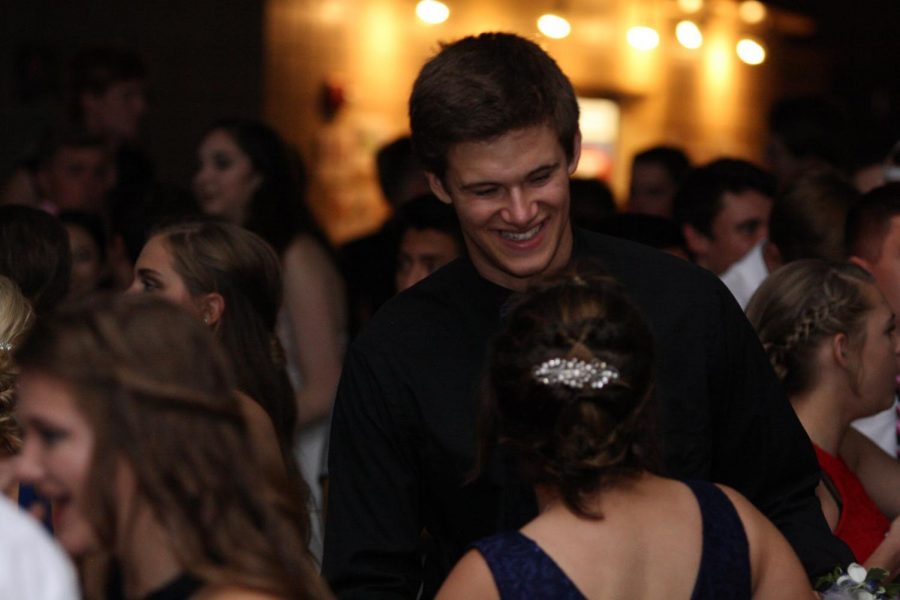 At the 2017-2018 Homecoming Dance, Jacob Muff and his date danced to the music in the darkly lit dance room.