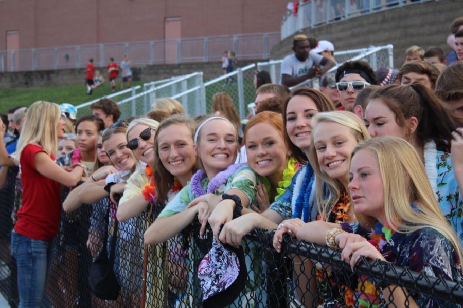 The student section dressed for the Hawaiian theme at the home football game vs. Lincoln Christian.