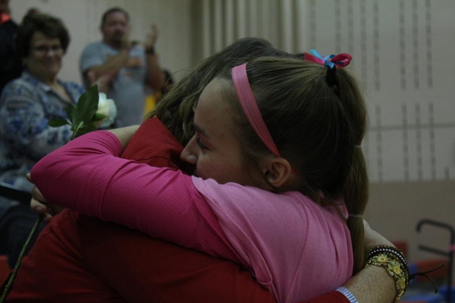 Teri Zanker and her mother share a moment during the Dig Pink Volleyball event. 