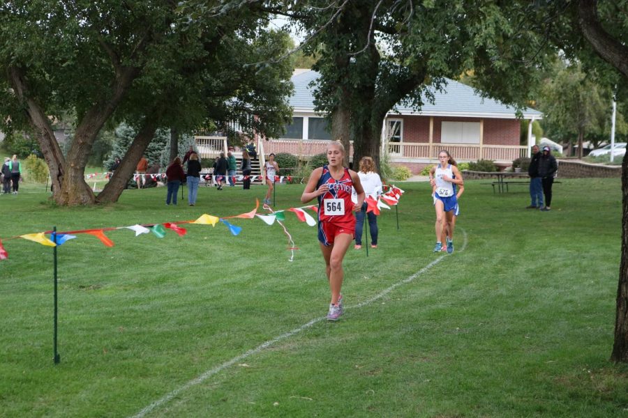 Senior Jacque McCullough ran during the girl’s conference meet held in September.