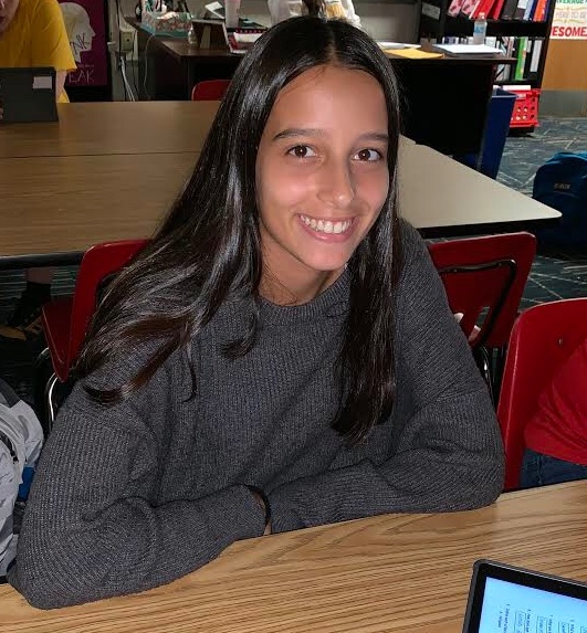 Sophomore Lua Abad Barja flashes her smile during class in Ms. Pedeliski’s classroom
