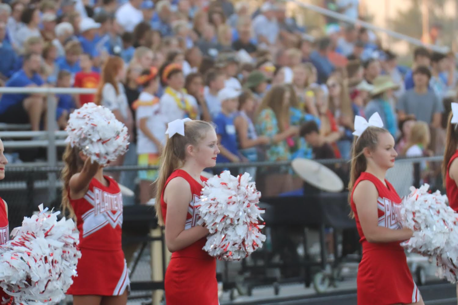 Platteview Cheerleaders, Mary Houlton and Baily Korenoski, spiriting at the home football game on September 6th, where the Trojans played the Blue Jays.