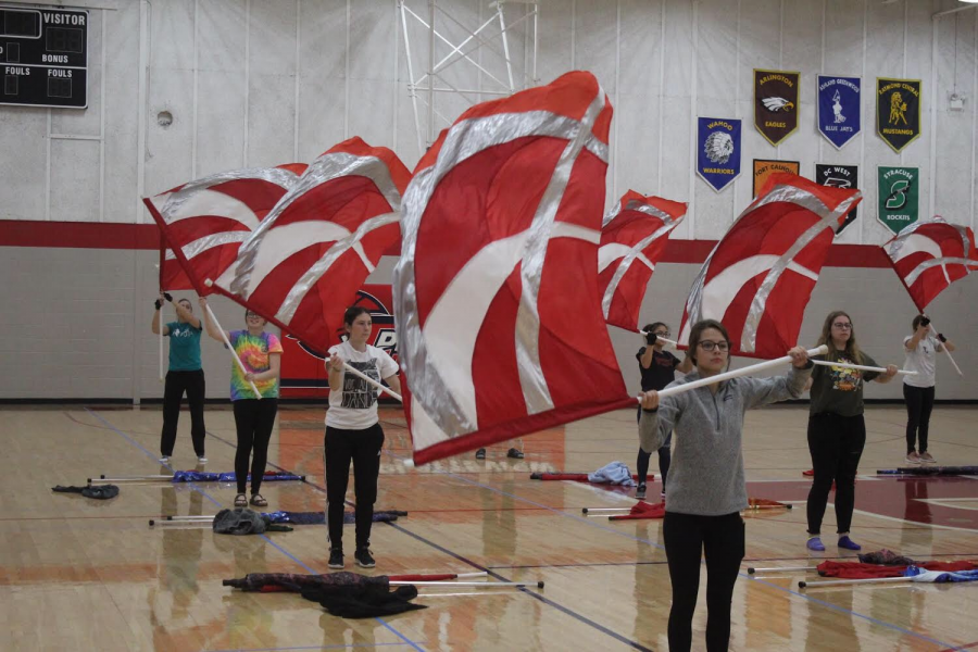 The Color Guard team practiced their routine in the front gym after school shortly before the State Marching Band competition.
