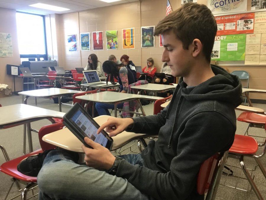 Sophomore Dylan Conover scrolls through articles on the Student News Source app. The app is free to download on both iOS and Android app stores, which makes reading Platteview’s latest news easier than ever.