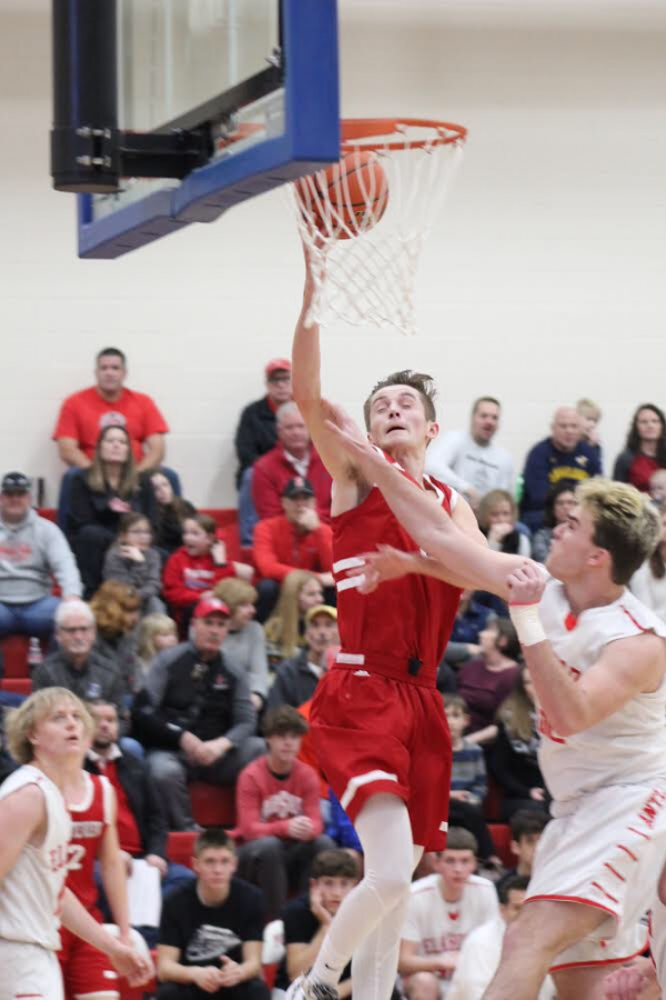 Senior Trey Brotzki shoots a layup during the Winter Tournament.