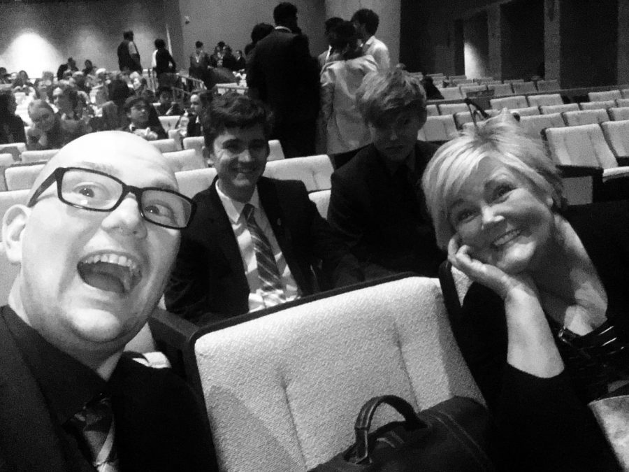 Dr. Kersulov, sophomore Luke Smith, senior Reed Lenker, and Mrs. Clayton paused for a picture at the awards ceremony for a speech meet at Elkhorn South High School. The meet occurred on March 6.