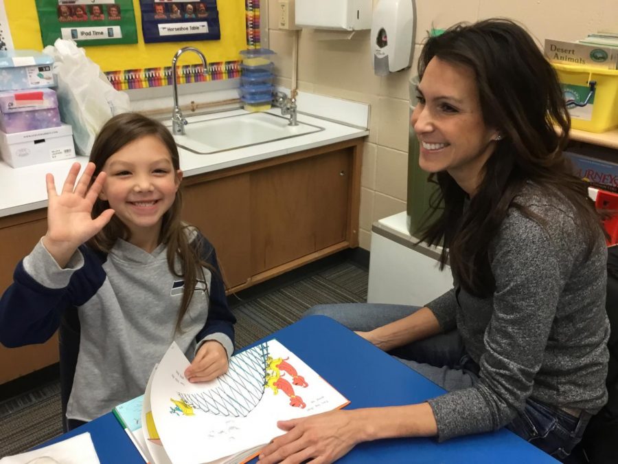 A Springfield Elementary student and her guest enjoy reading together to celebrate Read Across America.