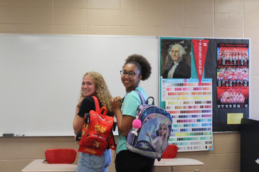 Julia Kreifels (12) and Priyanka Bowers(12) showing off their bold backpacks of the first day of school at Platteview, 2021-2022.
