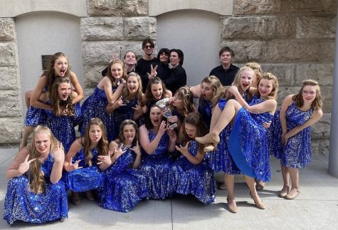 The Platteview Show Choir team celebrates after a performance.