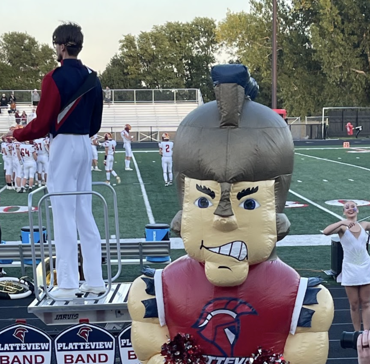 Terry the Trojan leads the audience in school spirit at a home football game.