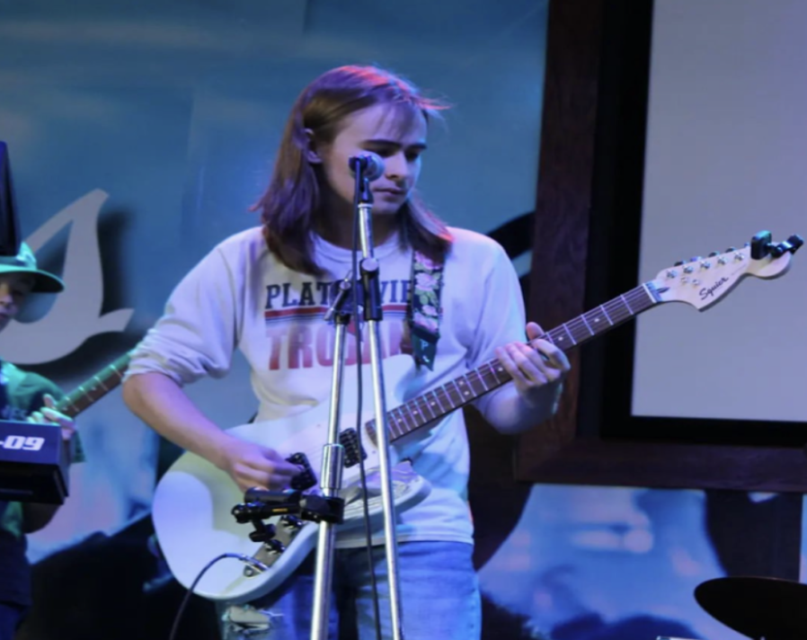 Elijah Wirth (11), shreds the guitar at a local performance. 