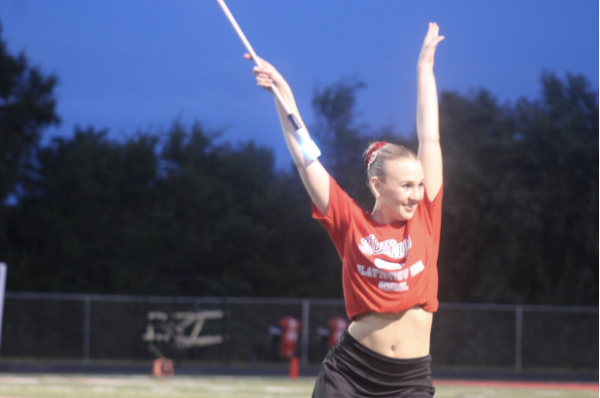 Presley Smith strikes a pose between baton tosses during the Marching Band performance
