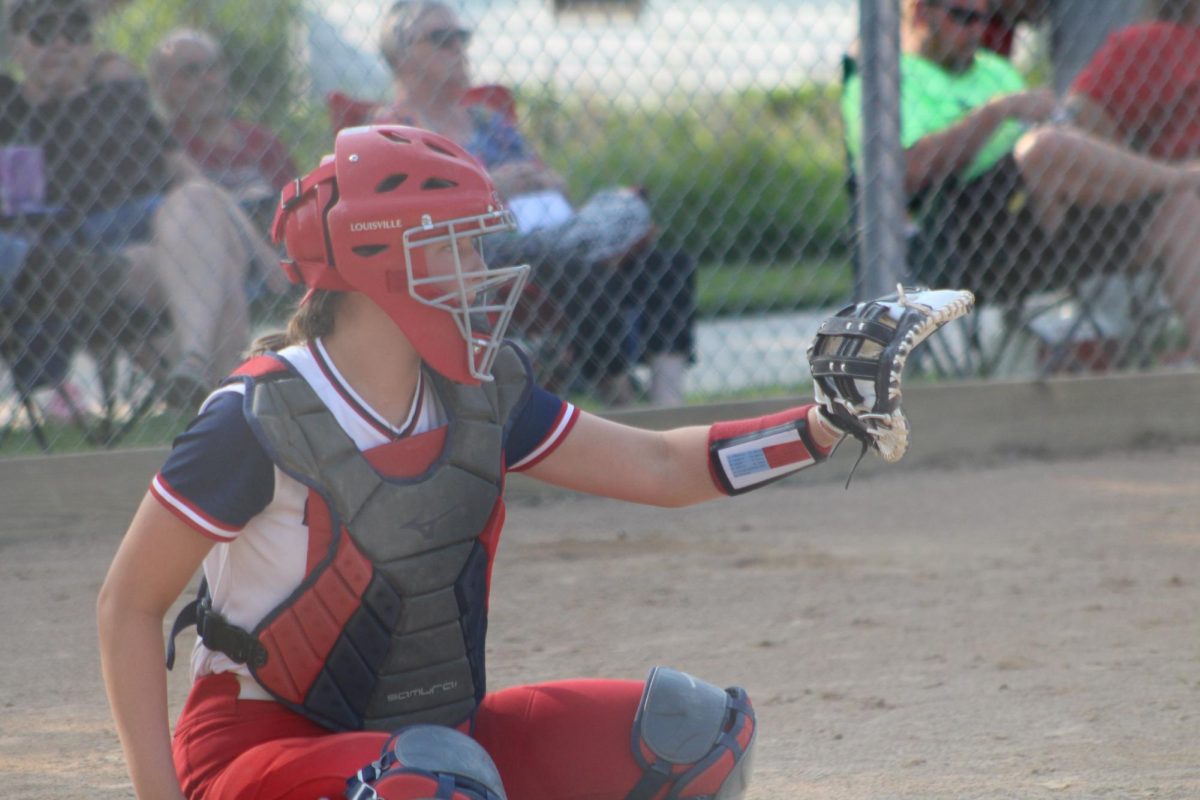 Kinsley Knief (11) is ready to catch the pitch.