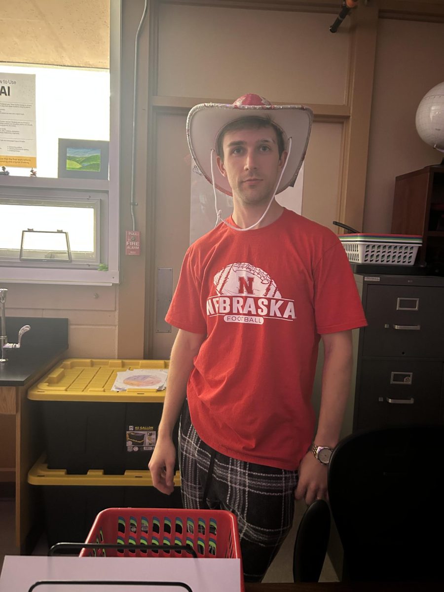 Mr. Veltre, one of the new Science teachers, styles a stunning
 pink cowboy hat during homecoming spirit week. 