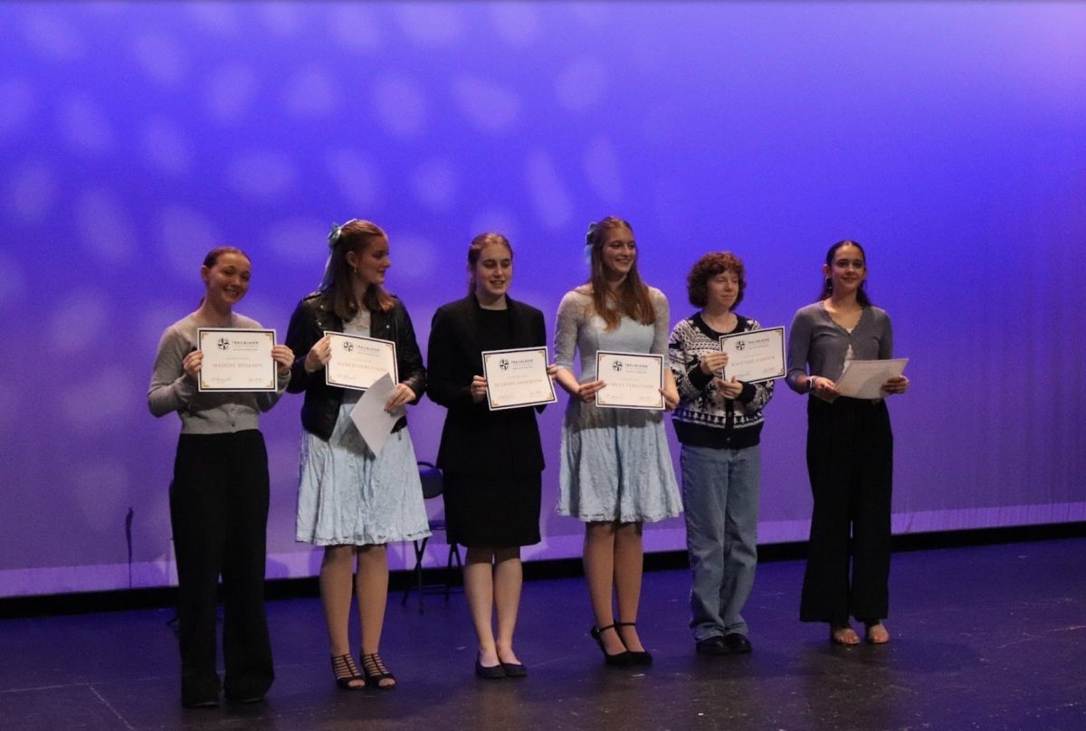 Say Cheese: Maddie Romans (12), Marlee Ferguson (12), Bethany Anderson (11), Maren Ferguson (12), Kaelynn Harder (12), and Eleni Moustakes (9) receive their conference best actress award.  
